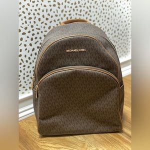 Used Michael Kors brown/tan backpack